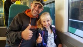 Grant and Holly on the train into the city